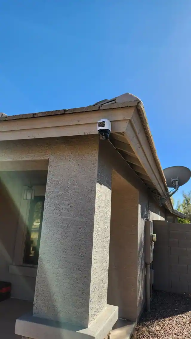 Dual-lens camera installed beneath a patio eave
