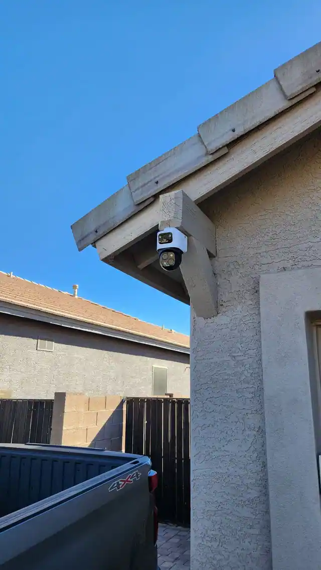 Dual-lens camera mounted to an exterior roof support