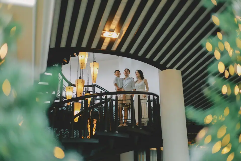 Family standing together inside a home
